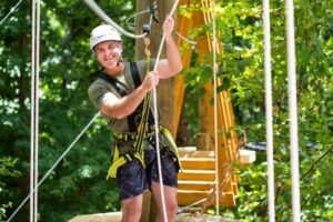 Man with helmet on obstacle course