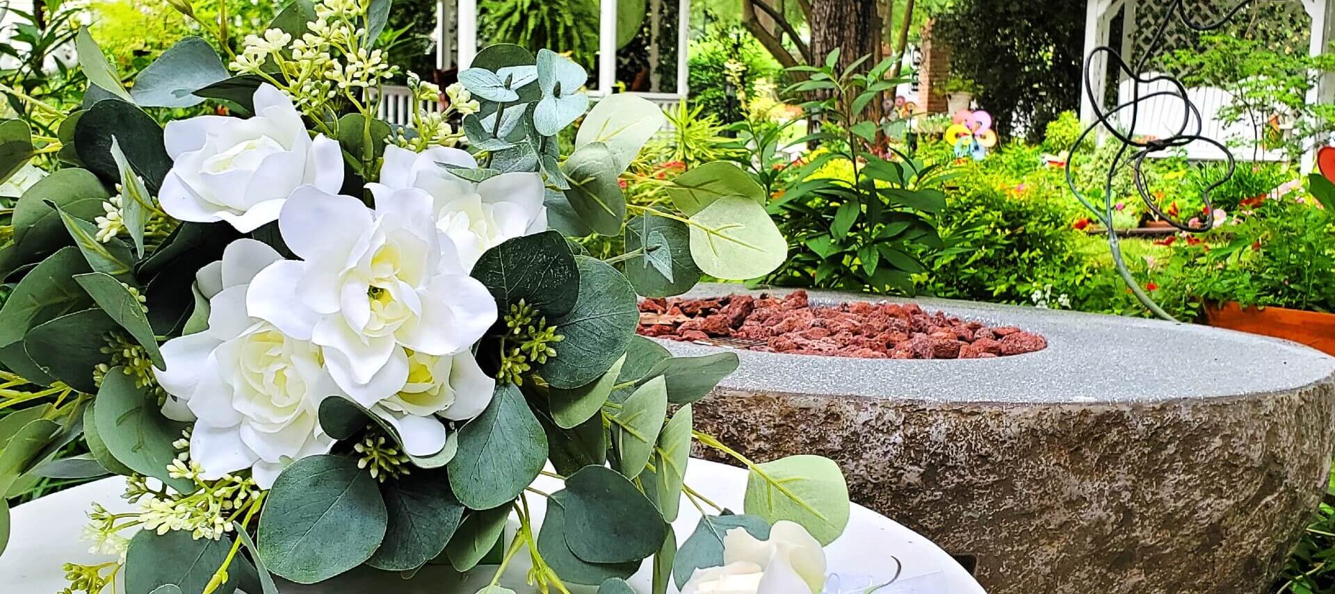 White bouquet in garden in front of gazebo